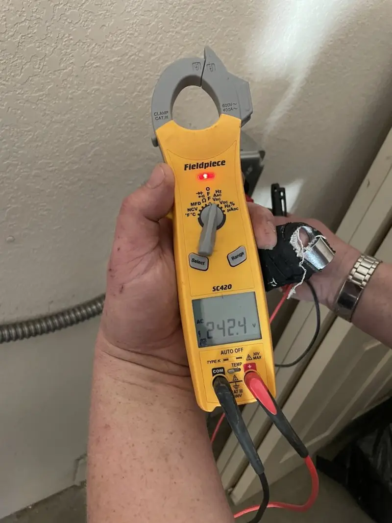 Voltage testing with clamp meter during Outlet Installation in South Cleveland